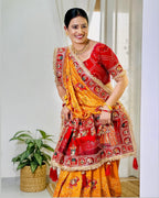 Tulsi Vat Savitri Special: Orange Yellow Vichitra Silk Saree with Narrative Embroidery & Latkan Tassels