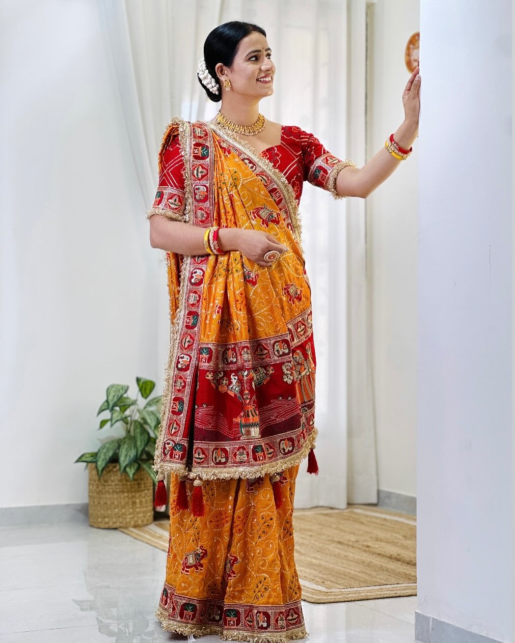 Tulsi Vat Savitri Special: Orange Yellow Vichitra Silk Saree with Narrative Embroidery & Latkan Tassels
