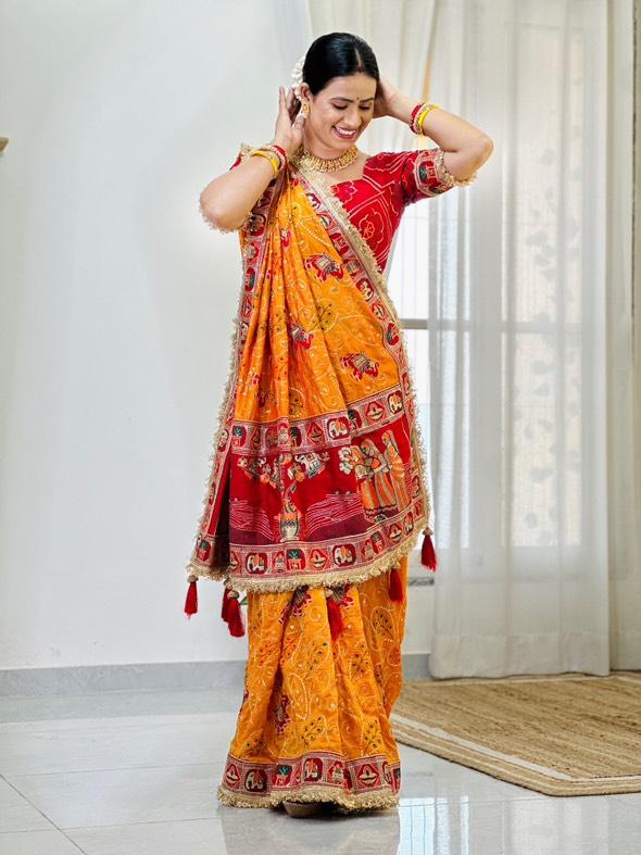 Tulsi Vat Savitri Special: Orange Yellow Vichitra Silk Saree with Narrative Embroidery & Latkan Tassels