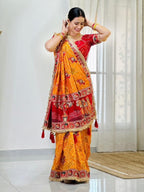 Tulsi Vat Savitri Special: Orange Yellow Vichitra Silk Saree with Narrative Embroidery & Latkan Tassels