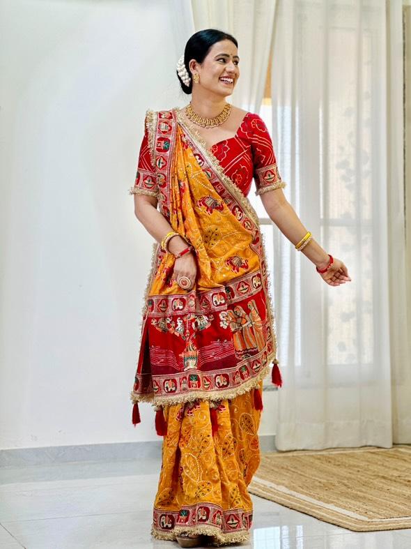 Tulsi Vat Savitri Special: Orange Yellow Vichitra Silk Saree with Narrative Embroidery & Latkan Tassels