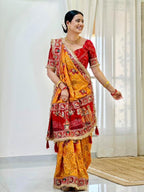 Tulsi Vat Savitri Special: Orange Yellow Vichitra Silk Saree with Narrative Embroidery & Latkan Tassels