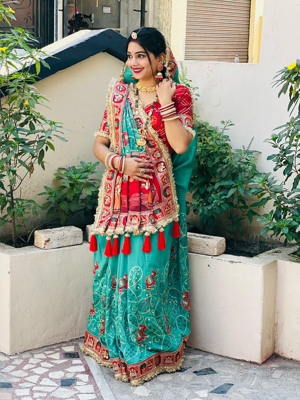 Tulsi Vat Savitri Special: Teal Greenish-Blue Vichitra Silk Saree with Traditional Narrative Embroidery & Tassels