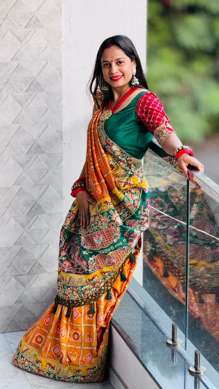 Kusum Sada Saubhagyavati Bhava Wedding Saree – Vibrant Orange-Yellow & Green