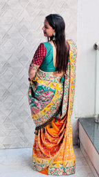 Kusum Sada Saubhagyavati Bhava Wedding Saree – Vibrant Orange-Yellow & Green