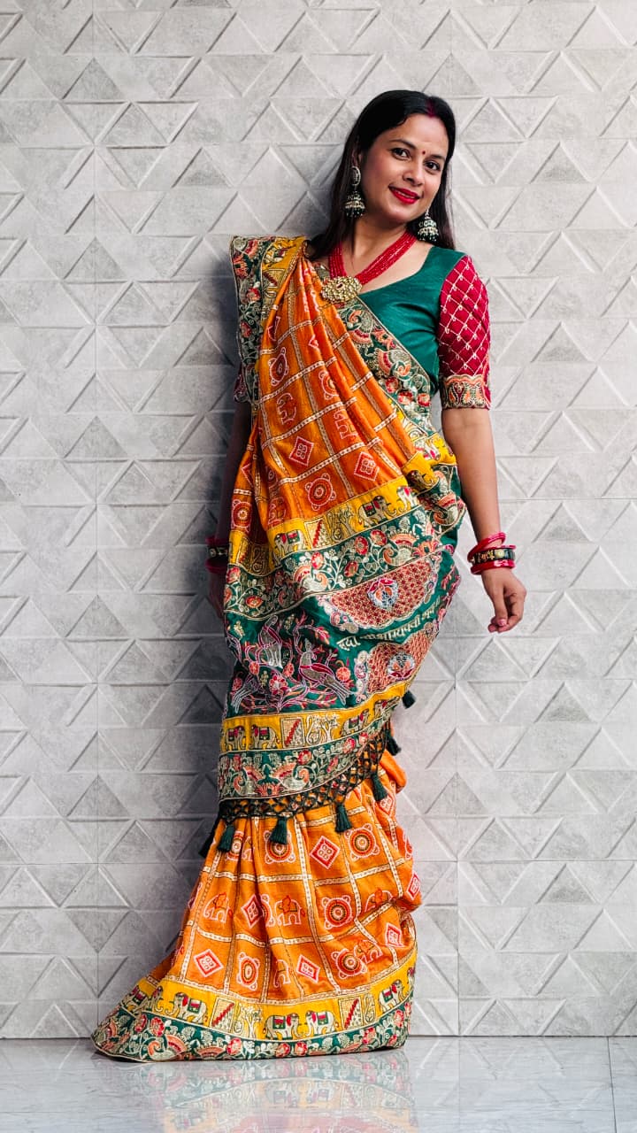 Kusum Sada Saubhagyavati Bhava Wedding Saree – Vibrant Orange-Yellow & Green