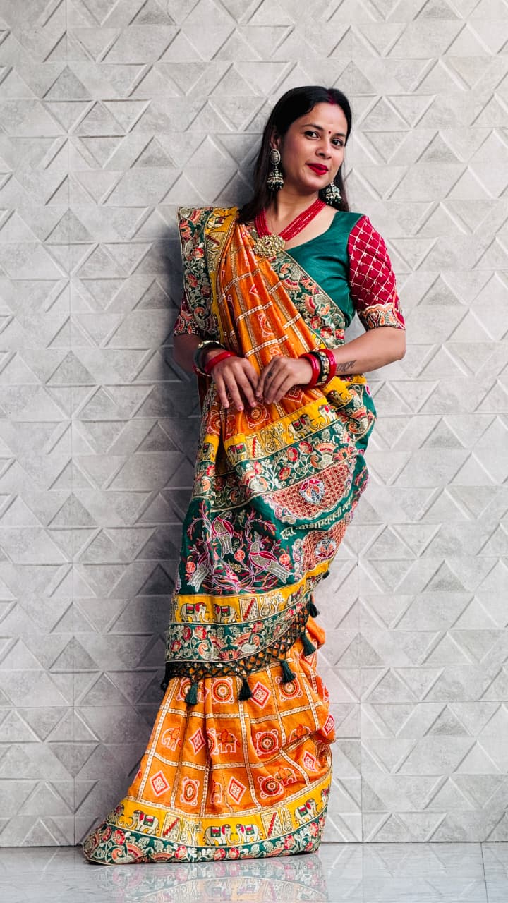 Kusum Sada Saubhagyavati Bhava Wedding Saree – Vibrant Orange-Yellow & Green
