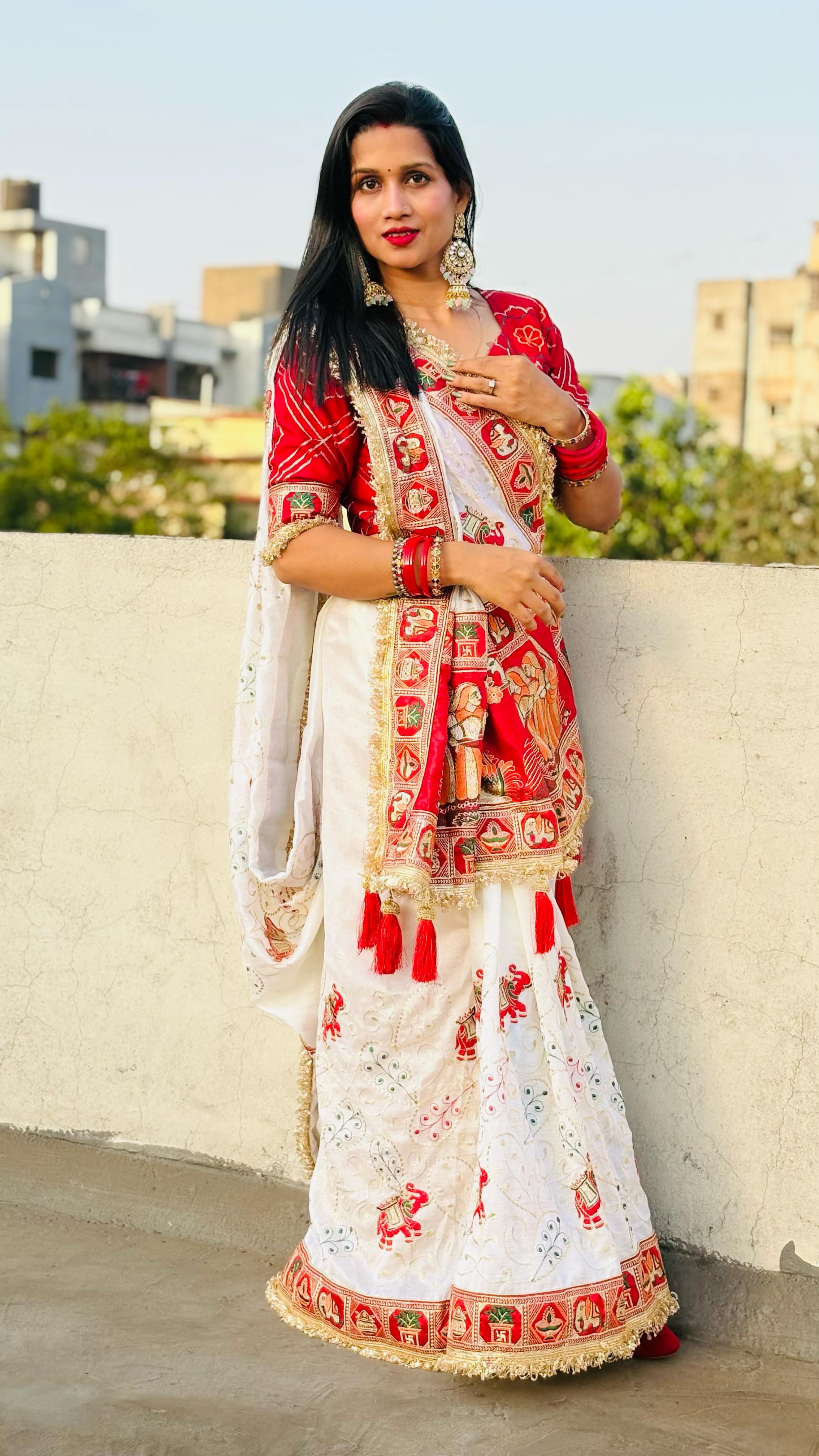Tulsi Vat Savitri Special: White Heavy Vichitra Silk Saree with Narrative Palla Embroidery, Lace Border & Latkan Tassels