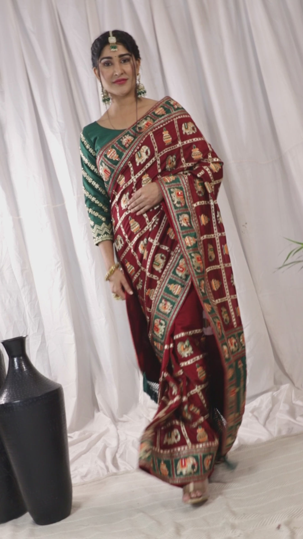 KAIRA Elegant Maroon & Green Silk Blend Saree with Heritage Patola Motifs and Rich Embroidered Pallu