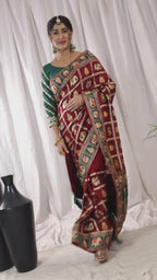 KAIRA Elegant Maroon & Green Silk Blend Saree with Heritage Patola Motifs and Rich Embroidered Pallu